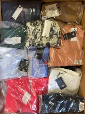 The photo shows a package with clothing in the category AW.