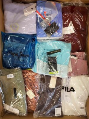 The photo shows a package with clothing in the category AW.