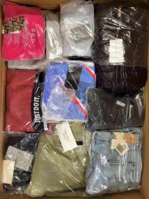 The photo shows a package with clothing in the category AW.