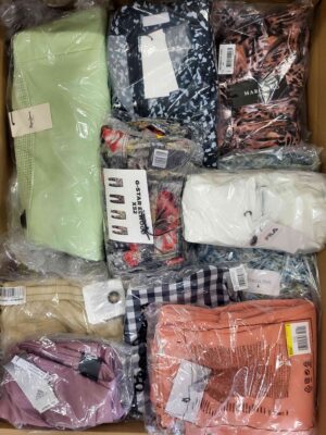 The photo shows a package with clothing in the category AW.