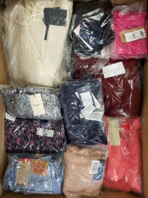 The photo shows a package with clothing in the category AW.