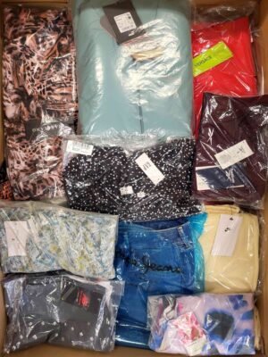 The photo shows a package with clothing in the category AW.