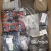 The photo shows a package with clothing in the category AP.