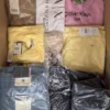 The photo shows a package with clothing in the category AP.