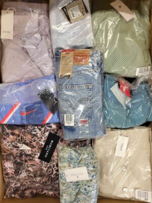 The photo shows a package with clothing in the category AW.