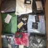 The photo shows a package with clothing in the category AP.