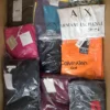 The photo shows a package with clothing in the category AP.