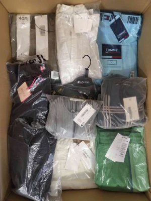 The photo shows a package with clothing in the category AP.