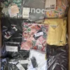 The photo shows a package with clothing in the category AP.