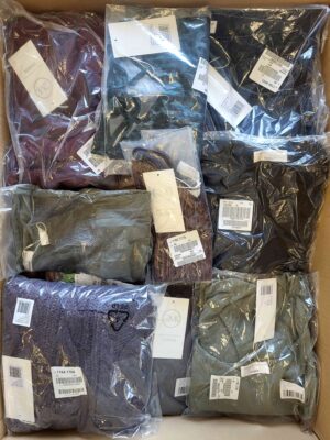 The photo shows a package with clothing in the category YA.