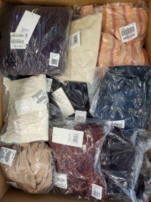 The photo shows a package with clothing in the category YA.