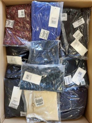 The photo shows a package with clothing in the category YA.