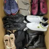 The photo shows a package with footwear in the category SH.