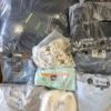 The photo shows a package with clothing in the category D.