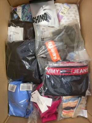The photo shows a package with clothing in the category ABW.