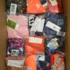 The photo shows a package with clothing in the category ABW.