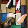 The photo shows a package with footwear in the category BS.