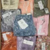 The photo shows a package with clothing in the category AR.