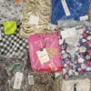 The photo shows a package with clothing in the category AR.
