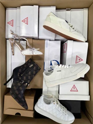 The photo shows a package with footwear in the category BS.