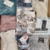 The photo shows a package with clothing in the category AR.
