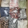 The photo shows a package with clothing in the category AR.