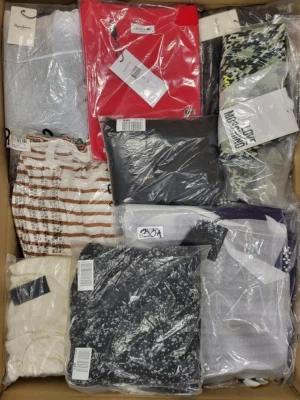 The photo shows a package with clothing in the category AW.