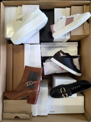 The photo shows a package with footwear in the category BS.