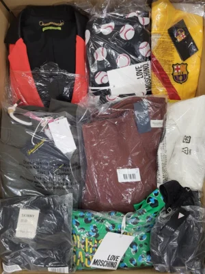 The photo shows a package with clothing in the category AW.