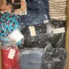 The photo shows a package with clothing in the category AW.