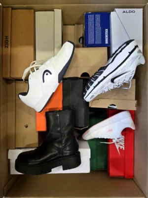 The photo shows a package with footwear in the category CS.