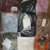 The photo shows a package with clothing in the category AW.