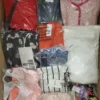 The photo shows a package with clothing in the category AW.