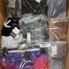 The photo shows a package with clothing in the category AM.