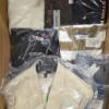 The photo shows a package with clothing in the category AM.