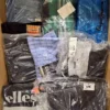 The photo shows a package with clothing in the category AM.