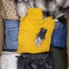 The photo shows a package with clothing in the category TSC.