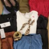 The photo shows a package with clothing in the category TSC.