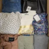 The photo shows a package with clothing in the category TSC.