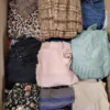 The photo shows a package with clothing in the category TSC.