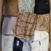 The photo shows a package with clothing in the category TSC.