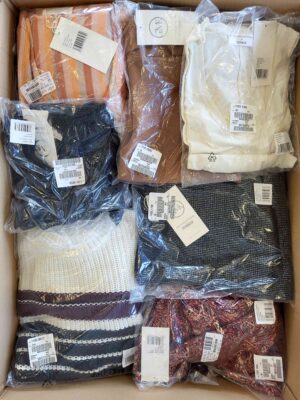 The photo shows a package with clothing in the category YA.