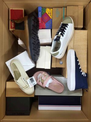 The photo shows a package with footwear in the category AS.