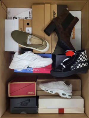 The photo shows a package with footwear in the category AS.