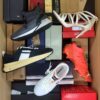 The photo shows a package with footwear in the category AS.