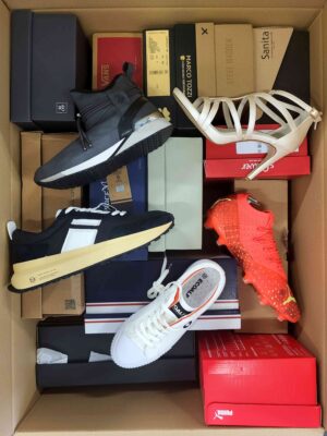 The photo shows a package with footwear in the category AS.