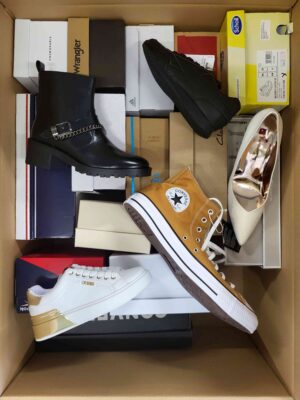 The photo shows a package with footwear in the category AS.