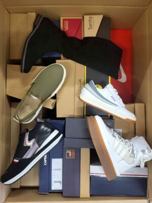 The photo shows a package with footwear in the category AS.