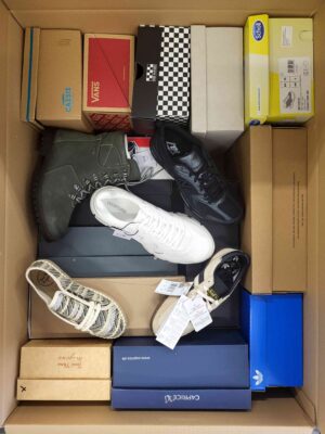 The photo shows a package with footwear in the category AS.