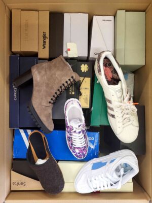 The photo shows a package with footwear in the category AS.